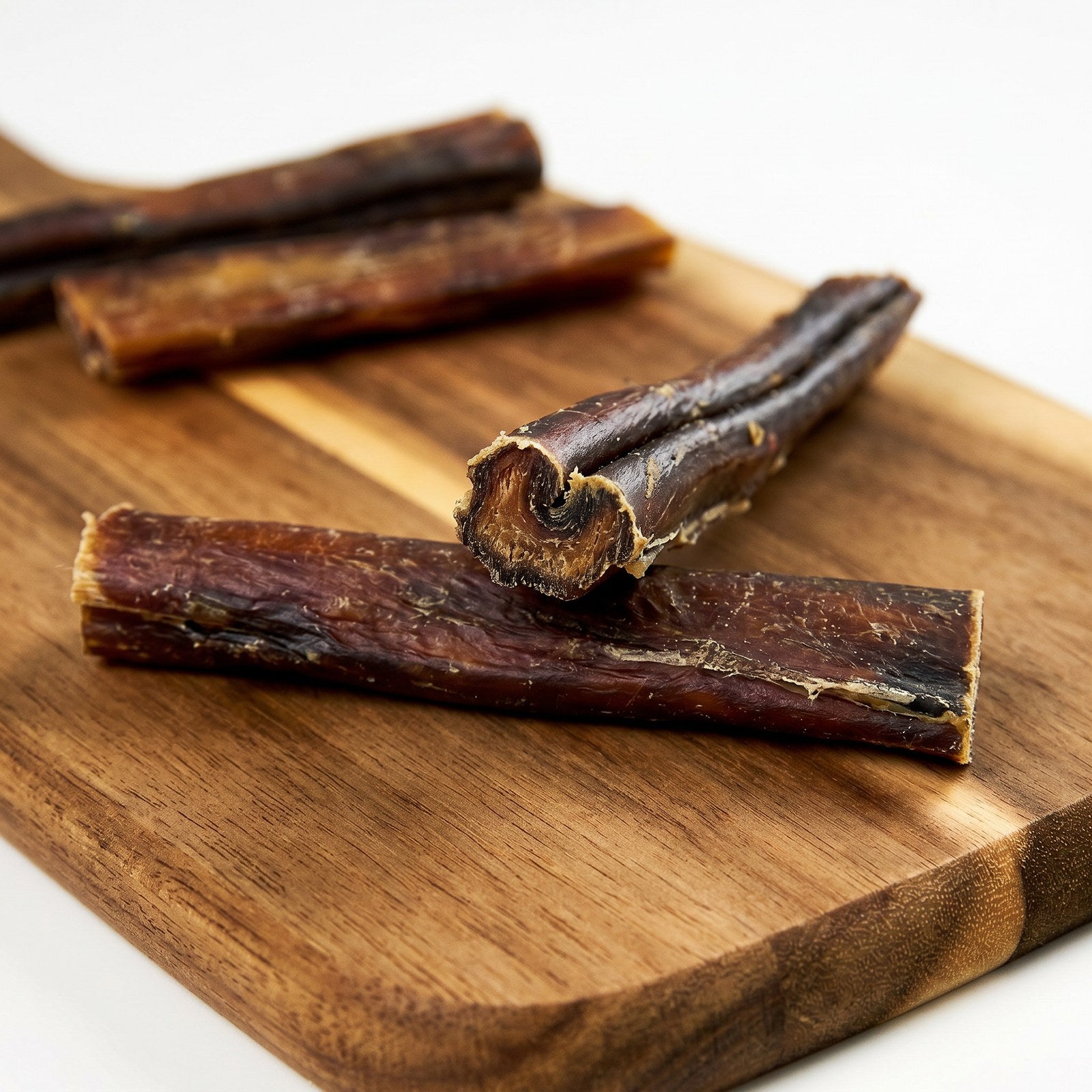 Alfie's Treatos Australian Bully Sticks on a board